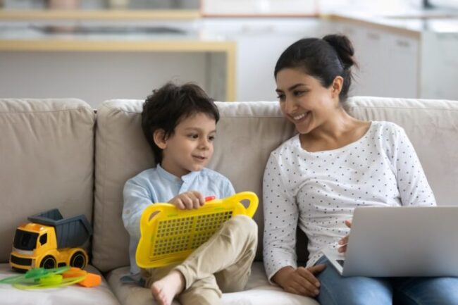 parent and child relaxing together on a couch