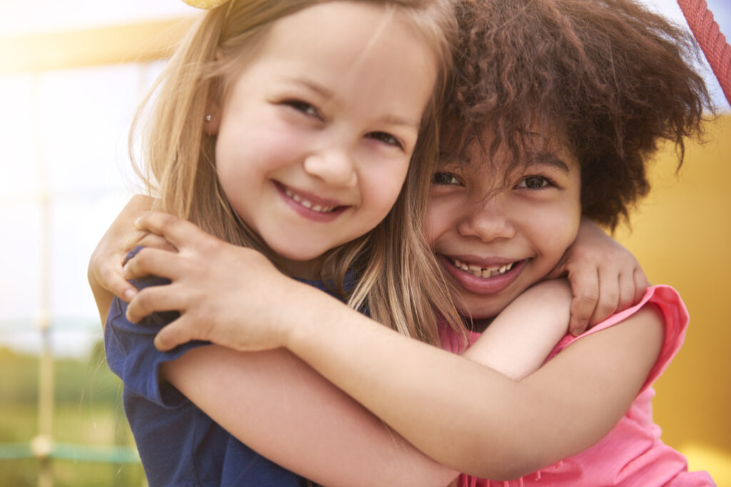 two kids hugging each other