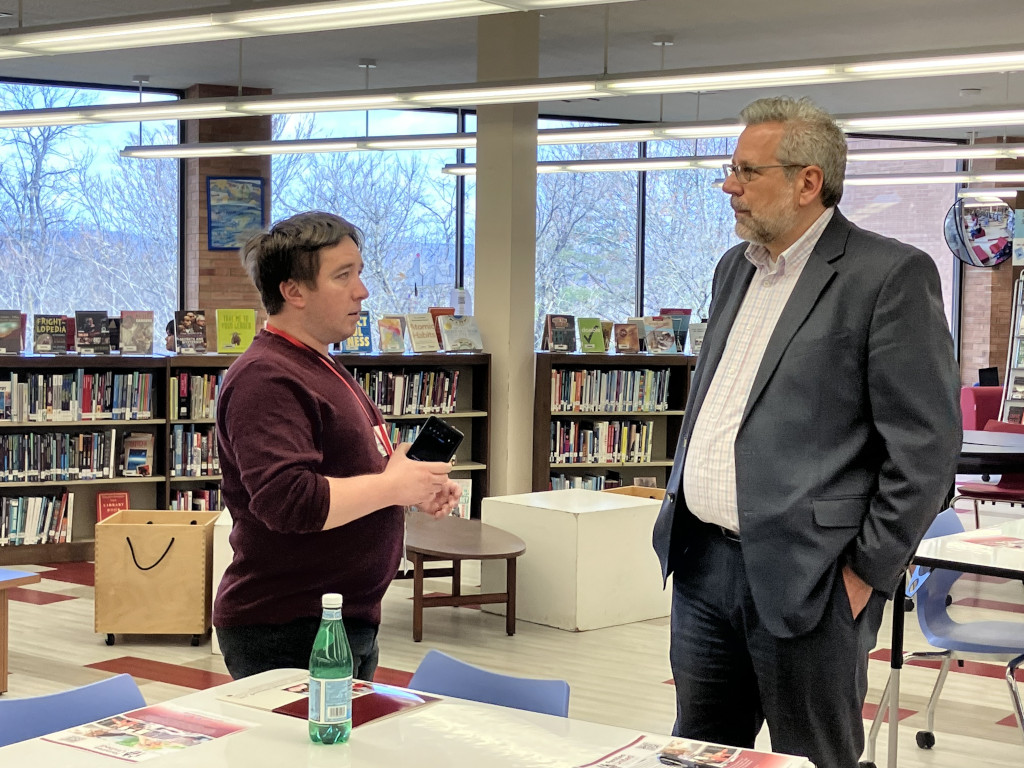 ron simon speaking to staff in a library